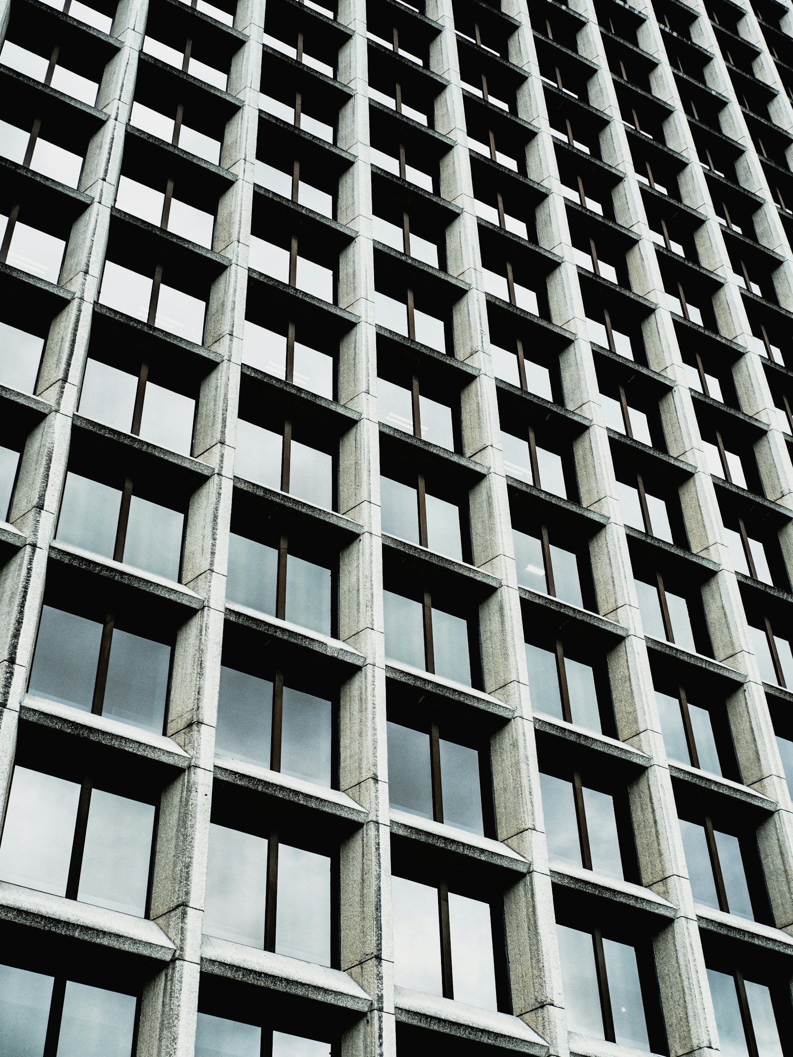 Geometric concrete and glass building facade